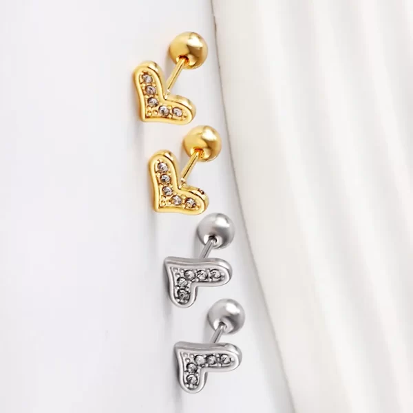 Heart-shaped earrings, gold and titanium color, embedded diamonds