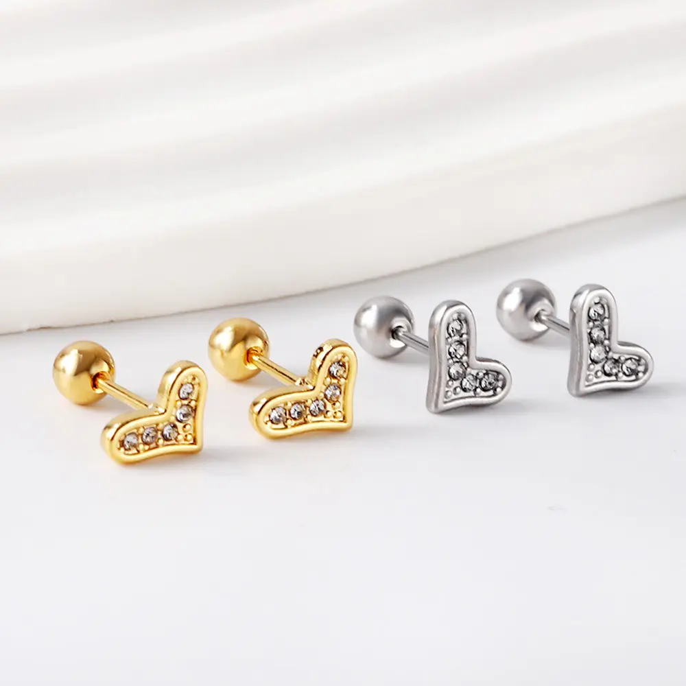 Heart-shaped earrings, gold and titanium color, embedded diamonds