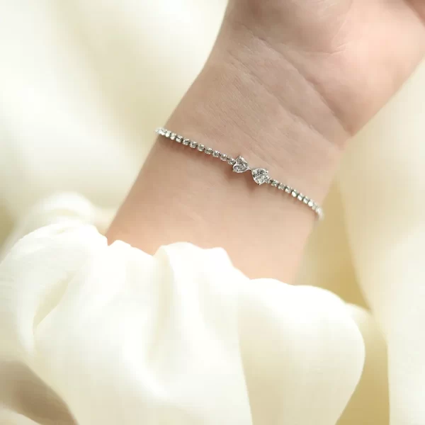 Love Double Heart Cubic Zircon Chain Clear Hand, shown on a woman's wrist