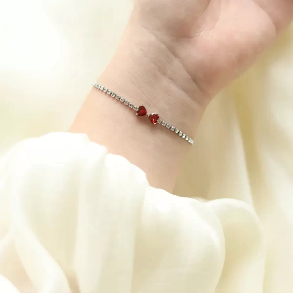 Love Double Heart Cubic Zircon Chain Red Hand, shown on a woman's wrist